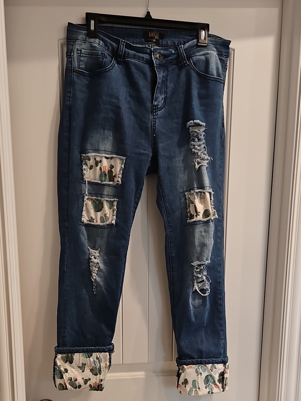 Western-inspired Distressed Boyfriend Jeans with Cactus Patch Details